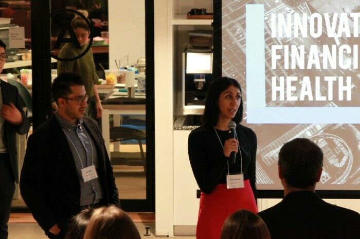 Two members of the altruWisdom team speaking at the launch of the Innovate Financial Health impact accelerator.
